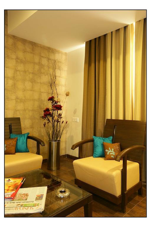Hotel Utsav Deluxe Púna Pokoj fotografie